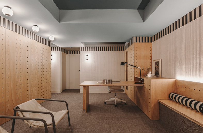Two shades of blue used on the ceiling create a sense of depth in the space and also add a calming element, with dark carpet covering the floor providing a similar effect. - Oleh Kardash